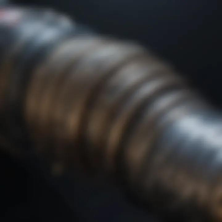 Close-up view of a lightsaber hilt showcasing intricate designs.